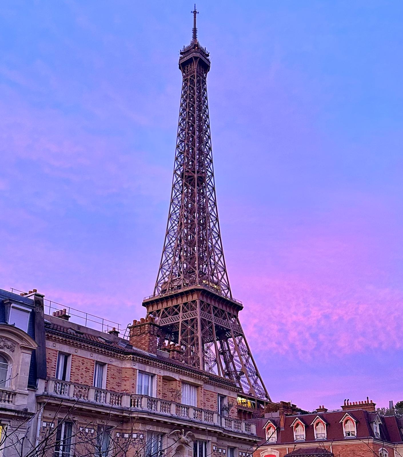 View of the Eiffel Tower at sunset from the apartment balcony